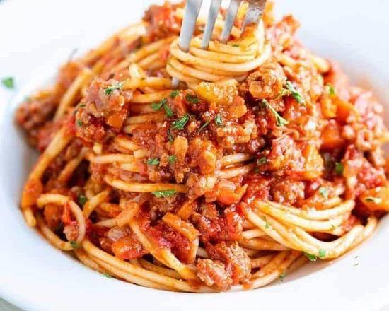 Spaghetti Bolognese — Slow-cooked ragù · herbs